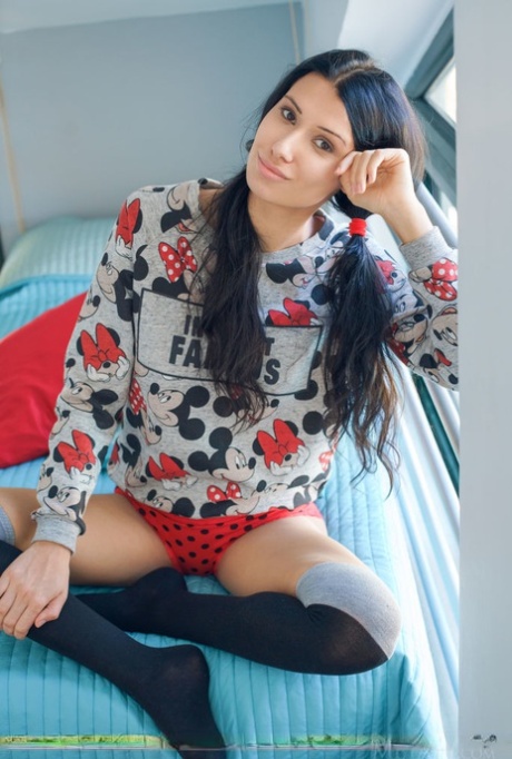 Leggy teen Alecto removes her clothes and OTK socks to pose totally naked