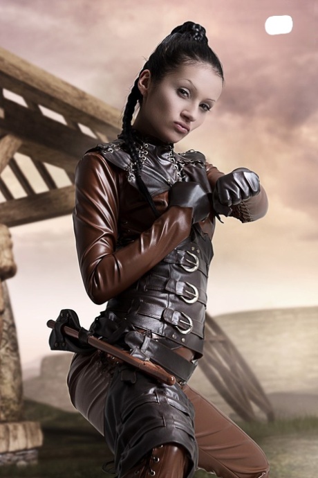 Cosplayer releases her firm tits and pussy from leather clothing