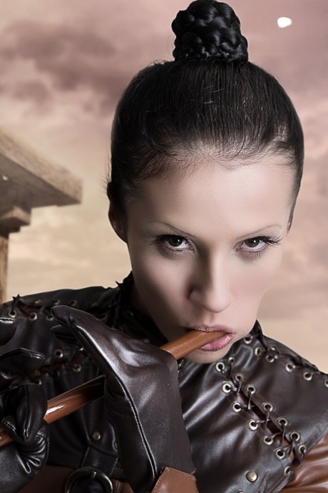 Cosplayer releases her firm tits and pussy from leather clothing