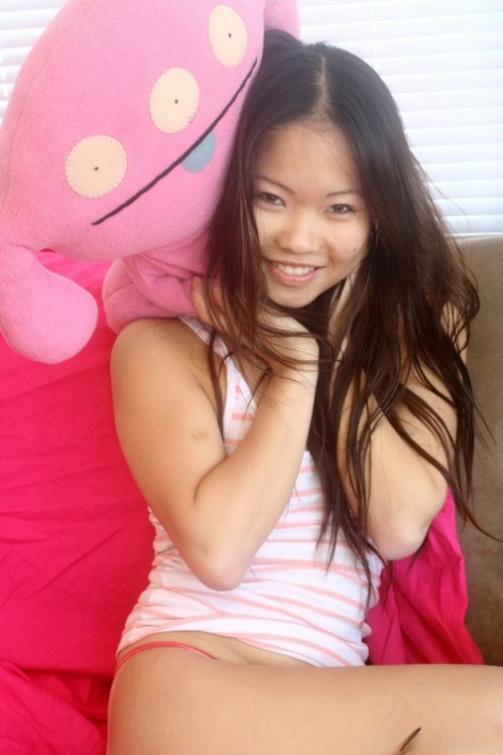 Delicious Asian teen Grace bends over and shows off her perfect tiny ass