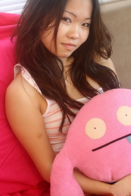 Delicious Asian teen Grace bends over and shows off her perfect tiny ass