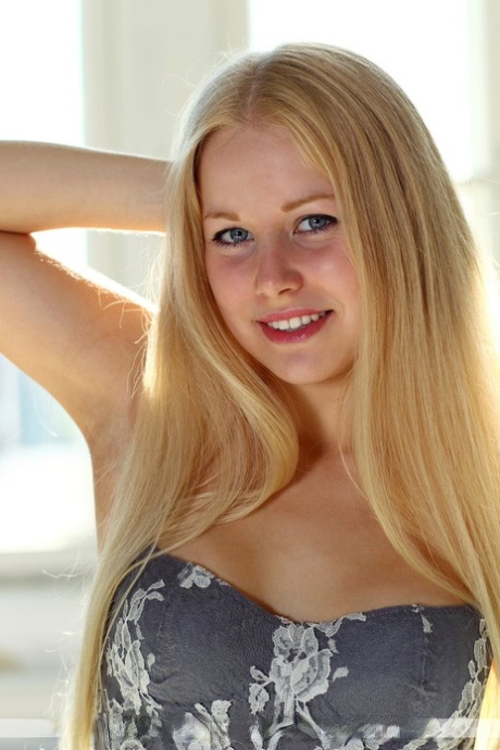 Young blonde girl Tatiana L wiggles her hips while getting naked