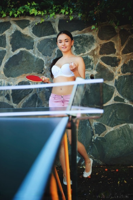 Petite Asian teen Li Moon exposes her hot body while playing ping pong