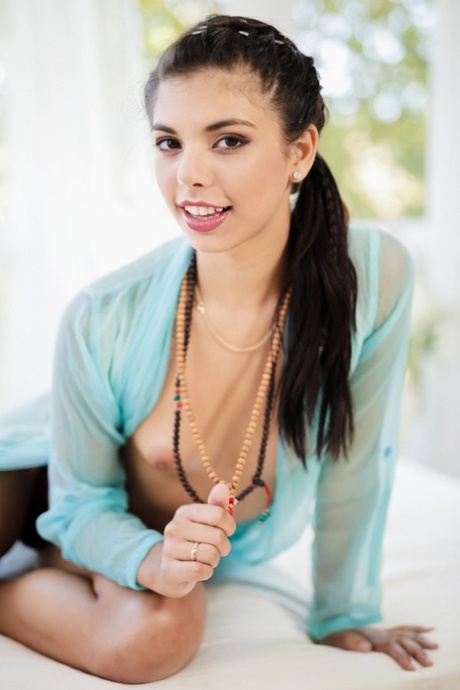 Beautiful Latina girl Gina Valentina casually divests herself off clothing