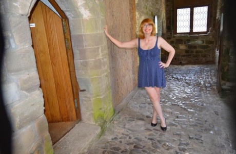 Redheaded amateur Barby Slut gets totally naked while wandering castle grounds