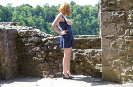 Redheaded amateur Barby Slut gets totally naked while wandering castle grounds
