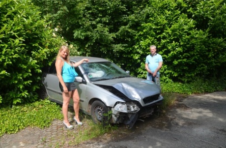Older blonde Sweet Susi sucks a dick by a wrecked automobile in the backyard