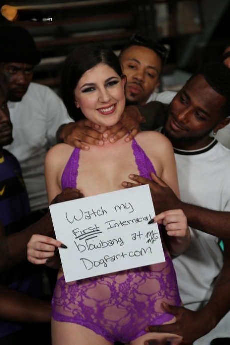 Petite white girl gets on her knees for an interracial blowbang