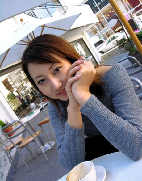 Japanese teen Shiho soaps up her bush while taking a bath after arriving home