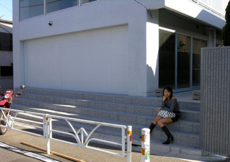 Japanese teen Shiho soaps up her bush while taking a bath after arriving home