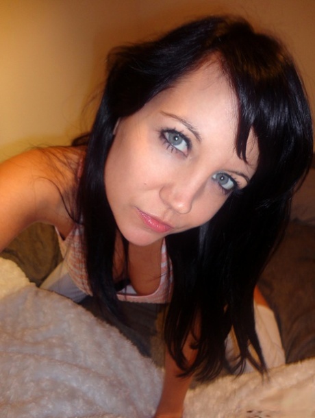 Brunette teen Andi Land takes selfies of her nice tits and sweet pussy