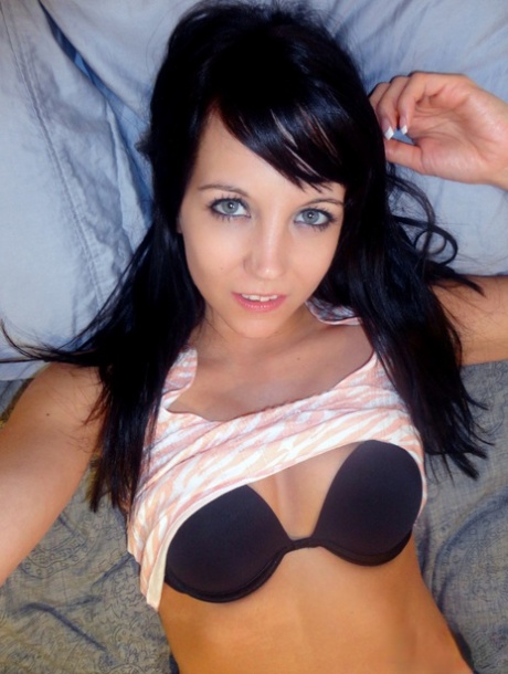 Brunette teen Andi Land takes selfies of her nice tits and sweet pussy