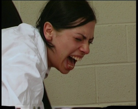 Schoolgirl receives a brutal caning over her desk from a male teacher