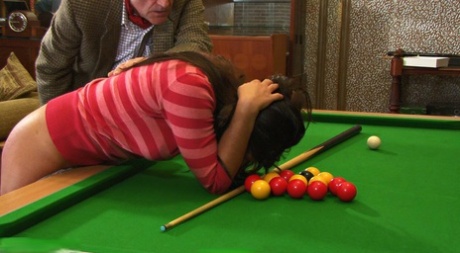 Caucasian girls have their asses spanked over a snooker table by an older man