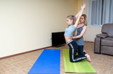 Blonde woman and her young stepdaughter have lesbian sex after doing yoga