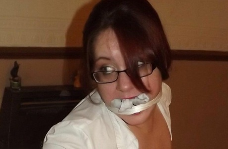 Overweight schoolgirl has her large tits exposed while gagged and restrained