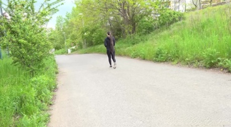 Clothed girl Lara Fox pulls down black leggings to pee by the side of a road