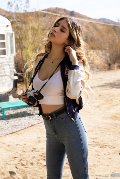 Latina teen Gina Marie strips totally naked outside a trailer