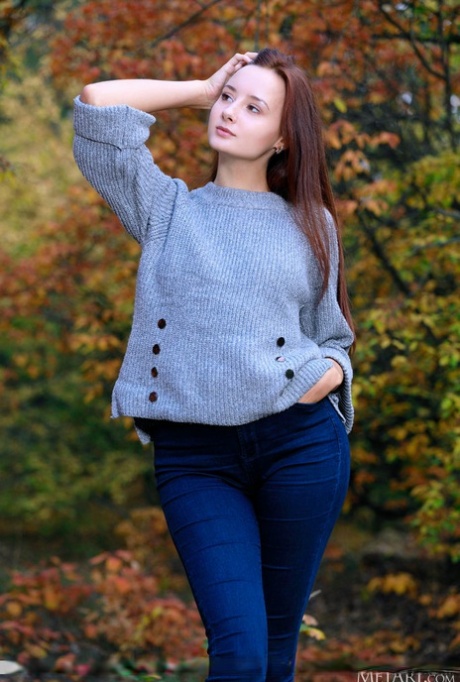 Nice young girl with an ass to die for gets totally naked in the woods