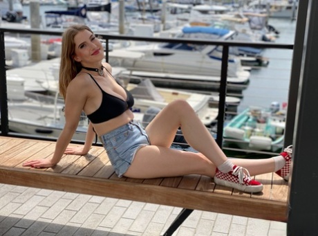 Octavia Red models a bikini at a marina before giving an ass licking blowjob