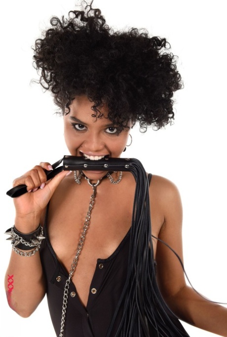 Brazilian solo model Selva Lapiedra wields a flogger before toying her cunt