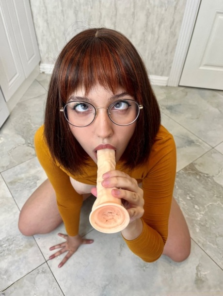 Solo girl Ksenia masturbates with a dildo while wearing glasses and knee socks