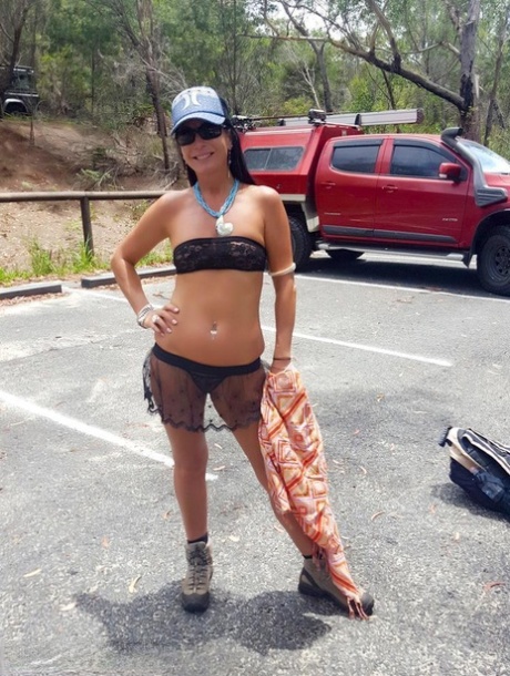 Brunette MILF Roxeanne shows her snatch at a public park