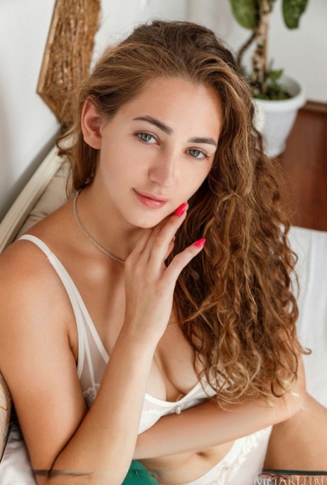 Beautiful teen Rene Soleil takes off her lingerie to pose nude
