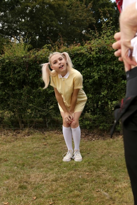 Blonde coed Chloe Toy watches a classmate jerk off in a yard