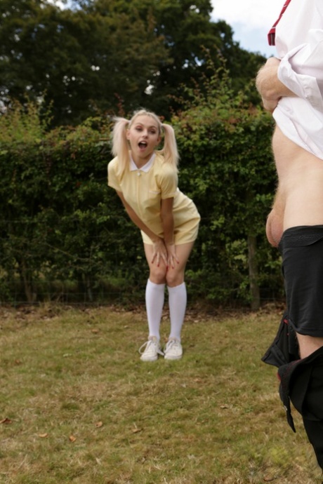 Blonde coed Chloe Toy watches a classmate jerk off in a yard