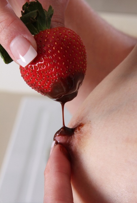 Middle-aged lady Celeste Carpenter takes off her apron to pose nude in kitchen