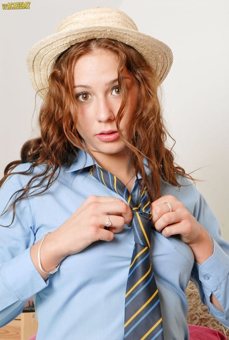 Redhead schoolgirl spreads her pussy wide open in retro styled lingerie