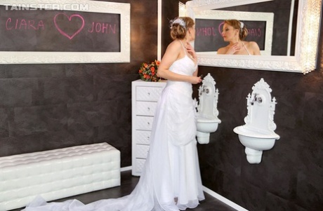 Blonde chick in a wedding dress gets doused in sperm at a gloryhole