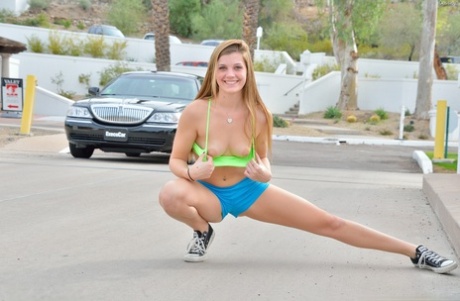 Cute young chick strips down in public and fingers her tight asshole