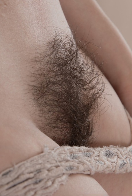 Hairy amateur Penelope Fiore sets her hairy twat free from lace panties