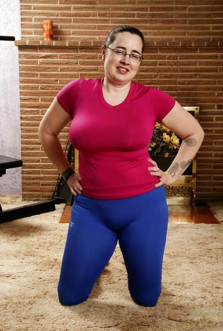 Mature fatty in glasses showing off hairy underarms and fleshy breasts