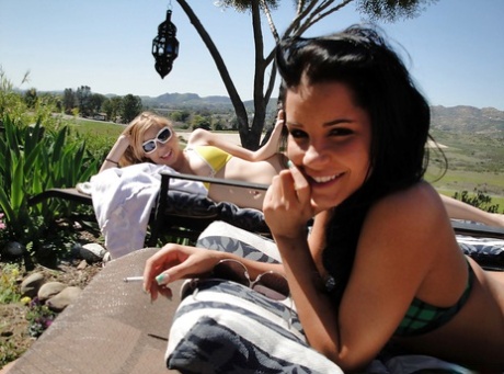 Young lesbians in glasses Nicole and Tanner kissing naked outdoor