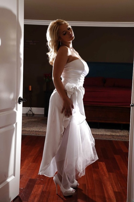 Awesome babe Sarah Vandella poses in stockings showing her big tits