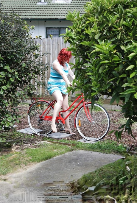 Chubby redhead babe stripping and exposing her hairy pussy outdoor