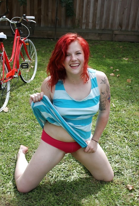 Chubby redhead babe stripping and exposing her hairy pussy outdoor