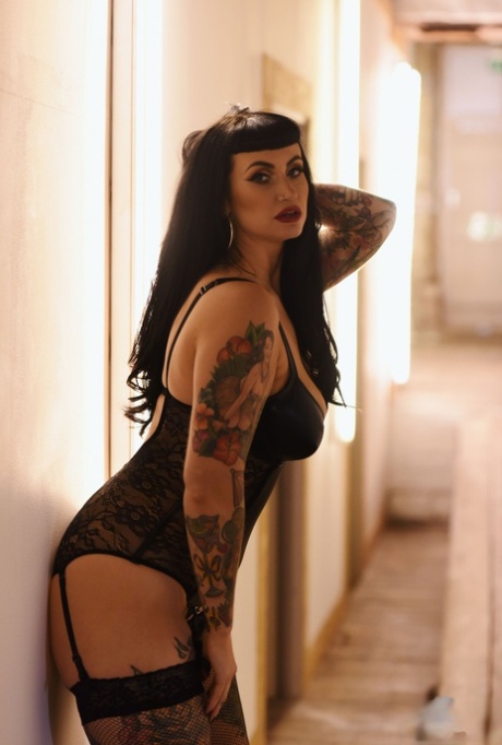 Thick model Cherrie Pie flaunts her tattooed body and big tits in lingerie