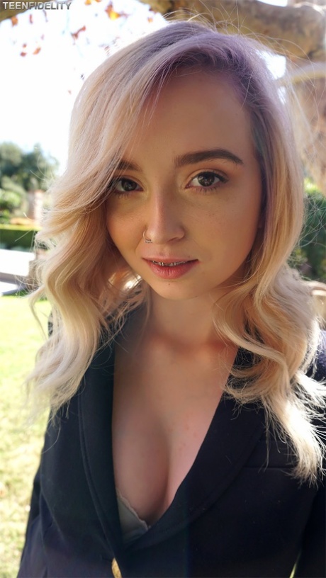Skinny teen cutie Lexi Lore shows pierced natural tits naked under a tree