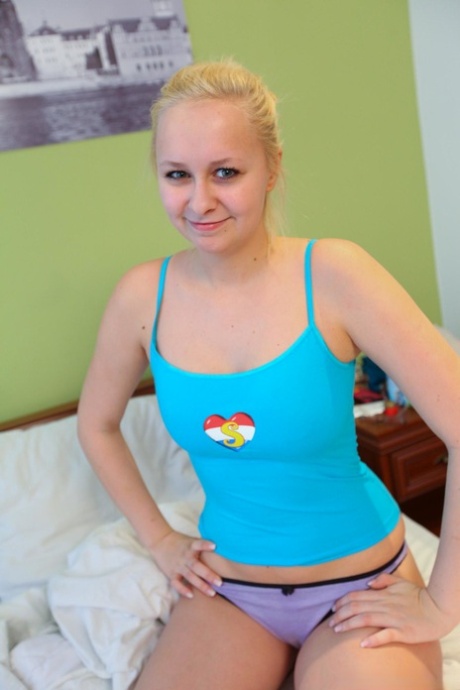Blonde honey Emily F and her girlfriend finger each other's twat on a bed