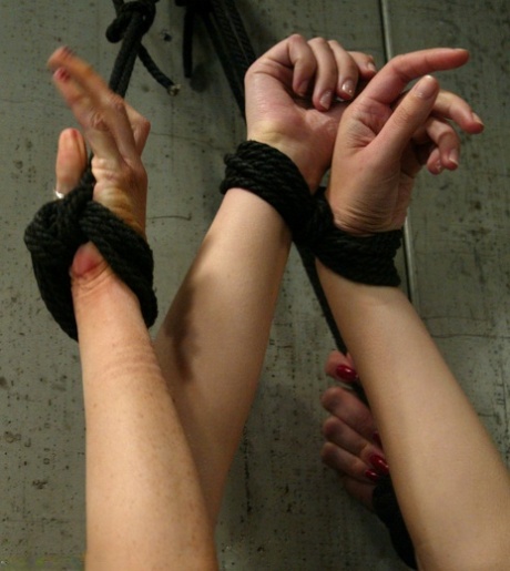 Sexy girls with nice juggs get punished with water while tied up in a prison