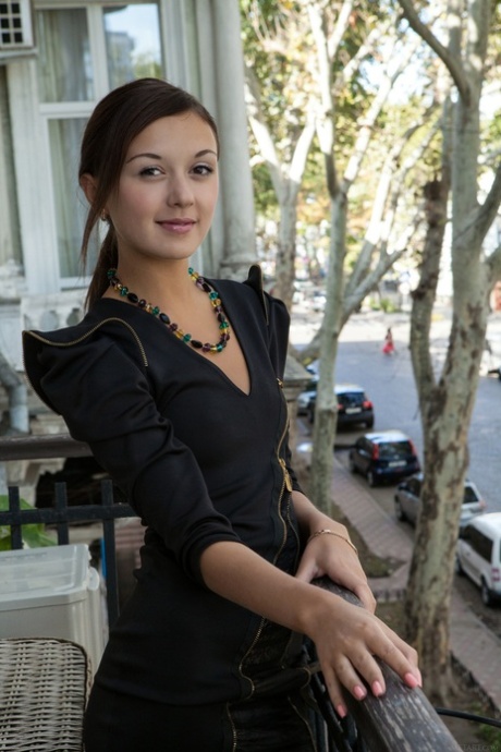 Petite babe Veselin shows her beautiful shaved pussy while playing her piano