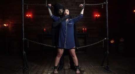 Stunning curvy MILF Ivy LeBelle gets tied up and toyed on a BDSM table