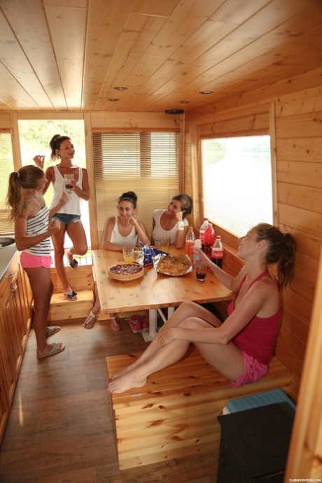Sweet teens with small tits toy each other on a boat on the river