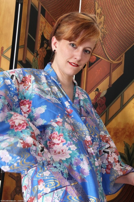 Petite amateur MILF Alex S strips her kimono & corset & masturbates with dice