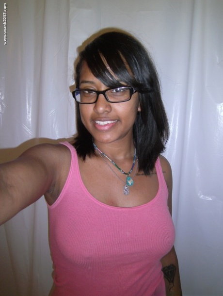 Nerdy ebony reveals her juicy bosom and round ass in a solo show