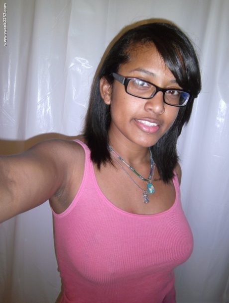 Nerdy ebony reveals her juicy bosom and round ass in a solo show
